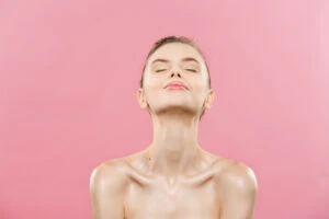 beauty concept beautiful woman with clean fresh skin close up pink studio skin care face cosmetology