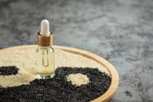 sesame oil sesame seeds dark background 1150 45335